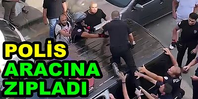 BİBER GAZI İLE POLİS ARACINA ZIPLADI