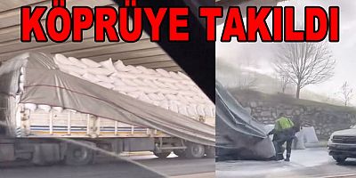 TIRA FAZLA YÜKLEDİ KÖPRÜYE TAKILDI