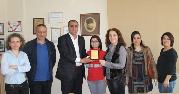 TUTUĞ'A PLAKET VERDİLER